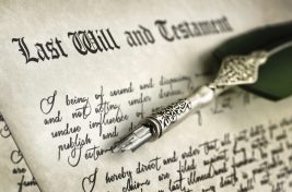 Last Will and Testament document with quill pen and handwriting